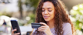 girl looking at credit card